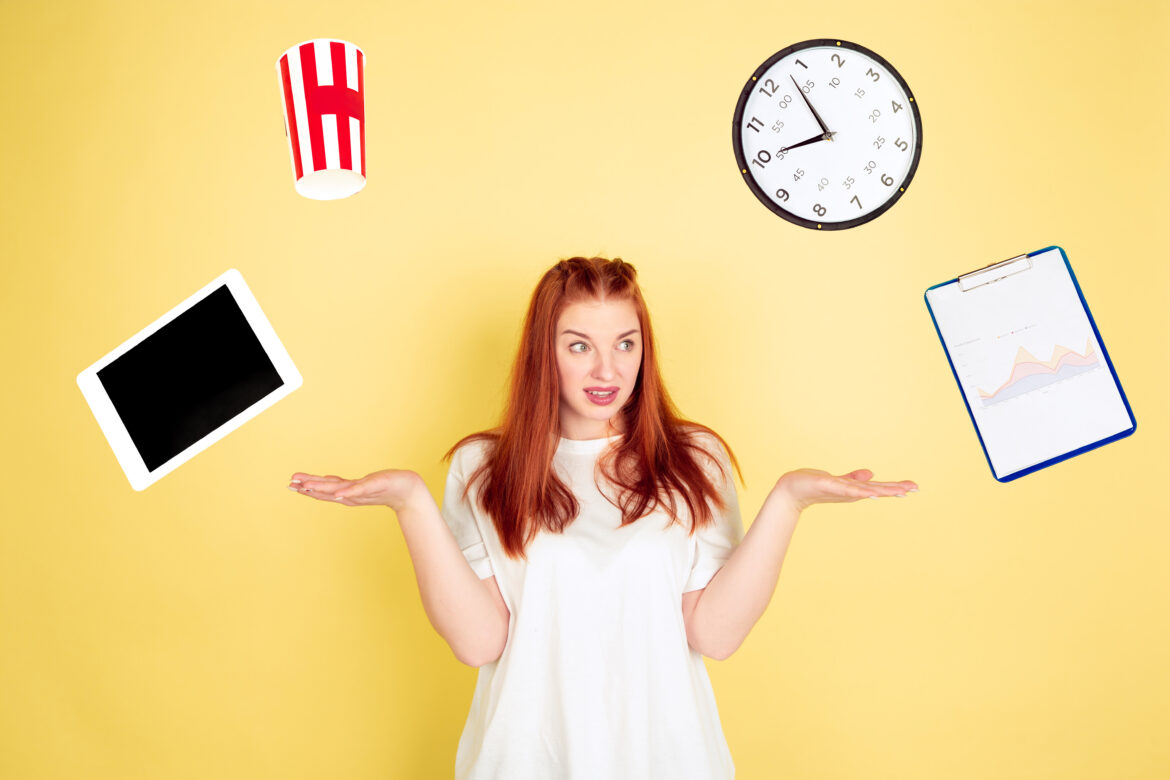 Caucasian young woman’s portrait on yellow background, too much tasks