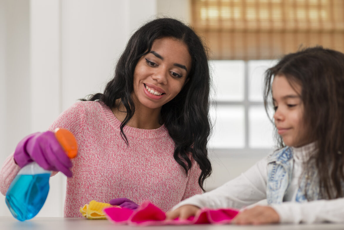 low-angle-mom-daughter-cleaning
